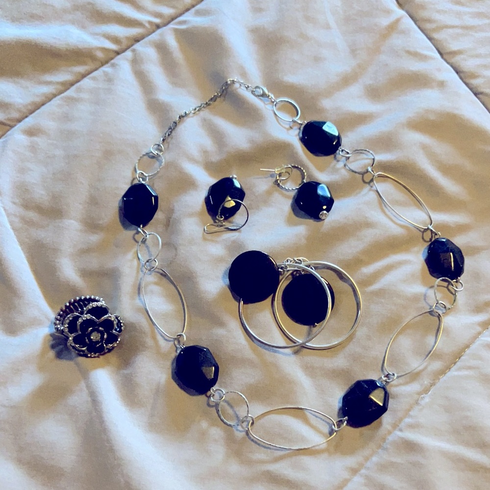 Black and silver necklace, earrings and flower ring